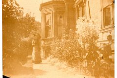 Woman with a parasol in the Flavel House Garden