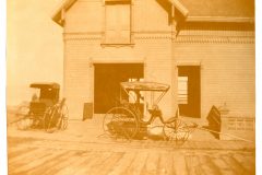 The Flavel Carriage House with two buggies in front