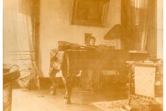 Flavel House Music Room with Nellie Flavel at the piano.