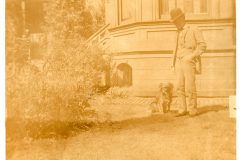 Man and a dog by the Flavel House