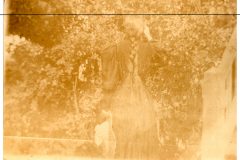 Woman with long braided hair outside the Flavel House