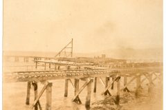 Railroad Tracks and dock with gill net drying racks on them.