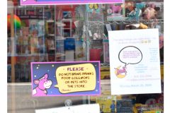 Signs in the Purple Cow Door